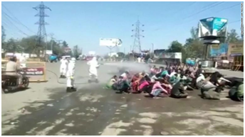MIGRANT WORKERS SPRAYED WITH DISINFECTANT ON RETURING HOME
